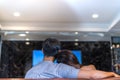 Young couple together watching tv sitting sofa in living room at home happy Royalty Free Stock Photo