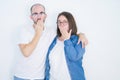 Young couple together wearing glasses over white isolated background cover mouth with hand shocked with shame for mistake, Royalty Free Stock Photo