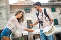 Young couple of tourist near a drinking fountain