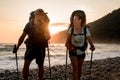 young couple tourists look at each other against the background of sunset Royalty Free Stock Photo