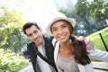 Young couple of tourists walking in central park Royalty Free Stock Photo