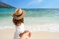Young couple traveler holding hands relaxing and enjoying at beautiful tropical white sand beach Royalty Free Stock Photo