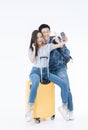 Young Couple traveler with luggage on white background. Man and girl preparing for vacation. Asian Couple traveler with luggage Royalty Free Stock Photo