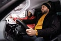 Young couple traveling by car, view through window. Winter vacation Royalty Free Stock Photo