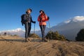 Young couple travellers trekking in Poon Hill view point in Ghorepani, Nepal