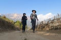 Young couple travellers trekking in Poon Hill view point in Ghorepani, Nepal