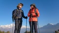 Young couple travellers trekking in Poon Hill view point in Ghorepani, Nepal