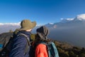 Young couple travellers trekking in Poon Hill view point in Ghorepani, Nepal