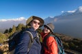 Young couple travellers trekking in Poon Hill view point in Ghorepani, Nepal