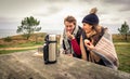 Young couple under blanket eating muffin outdoors Royalty Free Stock Photo