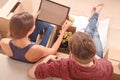 Young couple unpacking boxes Royalty Free Stock Photo