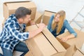 Young couple unpacking boxes Royalty Free Stock Photo