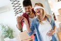 Young couple unpacking cardboard boxes at new home moving in concept Royalty Free Stock Photo