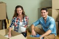 Young couple unpacking carton boxes Royalty Free Stock Photo