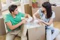 Young couple unpacking carton boxes in their new house Royalty Free Stock Photo