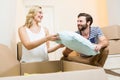 Young couple unpacking carton in their new house Royalty Free Stock Photo