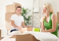 Young couple unpacking moving boxes