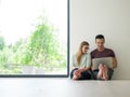 Couple using laptop on the floor at home Royalty Free Stock Photo