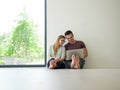 Couple using laptop on the floor at home Royalty Free Stock Photo