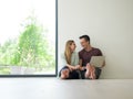 Couple using laptop on the floor at home Royalty Free Stock Photo