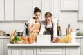 young couple using laptop during cooking Royalty Free Stock Photo