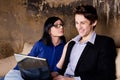 Young couple using laptop on couch Royalty Free Stock Photo