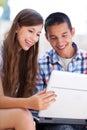 Young couple using laptop outdoors Royalty Free Stock Photo