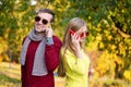 Young couple using a mobile phones. Young couple talking themselves by mobile phone. Royalty Free Stock Photo