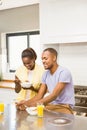 Young couple using tablet at breakfast Royalty Free Stock Photo