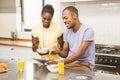 Young couple using tablet at breakfast Royalty Free Stock Photo