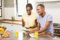 Young couple using tablet at breakfast Royalty Free Stock Photo