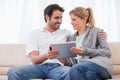 Young couple using a tablet computer Royalty Free Stock Photo