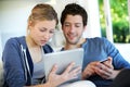 Young couple using tablet at home and shopping Royalty Free Stock Photo