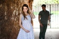 Young couple, very fashionable pregnant girl, couple in love in stone tunnel Royalty Free Stock Photo