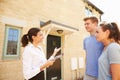 Young couple viewing a house with female real estate agent Royalty Free Stock Photo