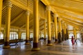 Young couple visiting the impressive interior of Kambawzathardi Golden Palace in Bago