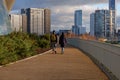 Young couple walk in Queen Elizabeth Olympic Park Royalty Free Stock Photo