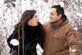 A young couple walk in a winter park Royalty Free Stock Photo