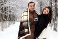 A young couple walk in a winter park Royalty Free Stock Photo