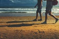 Young Couple Walking Along Beach Walking Together Concept Rear View Royalty Free Stock Photo