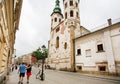 Young couple walking around old city with gothic buildings and curches