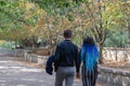 A young couple walking in an autumn park. Man and woman in love Royalty Free Stock Photo