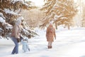 Young couple walking with a child