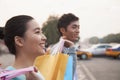 Young couple walking down the street with shopping bags in Beijing, close-up Royalty Free Stock Photo