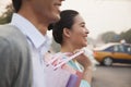 Young couple walking down the street with shopping bags in Beijing, close-up Royalty Free Stock Photo