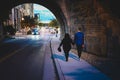 Young couple walking hand in hand through a tunnel Royalty Free Stock Photo