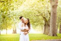 Young couple walking, Hyde Park, London: sunset colour tone Royalty Free Stock Photo