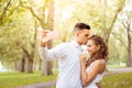 Young couple walking, Hyde Park, London: sunset colour tone Royalty Free Stock Photo