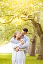 Young couple walking, Hyde Park, London: sunset colour tone Royalty Free Stock Photo