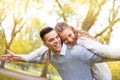 Young couple walking, Hyde Park, London: sunset colour tone Royalty Free Stock Photo